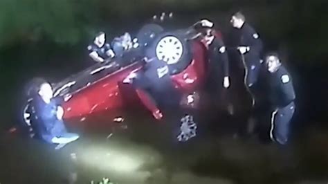 Bodycam video shows Orlando Police officers rescuing driver after SUV plunges into pond
